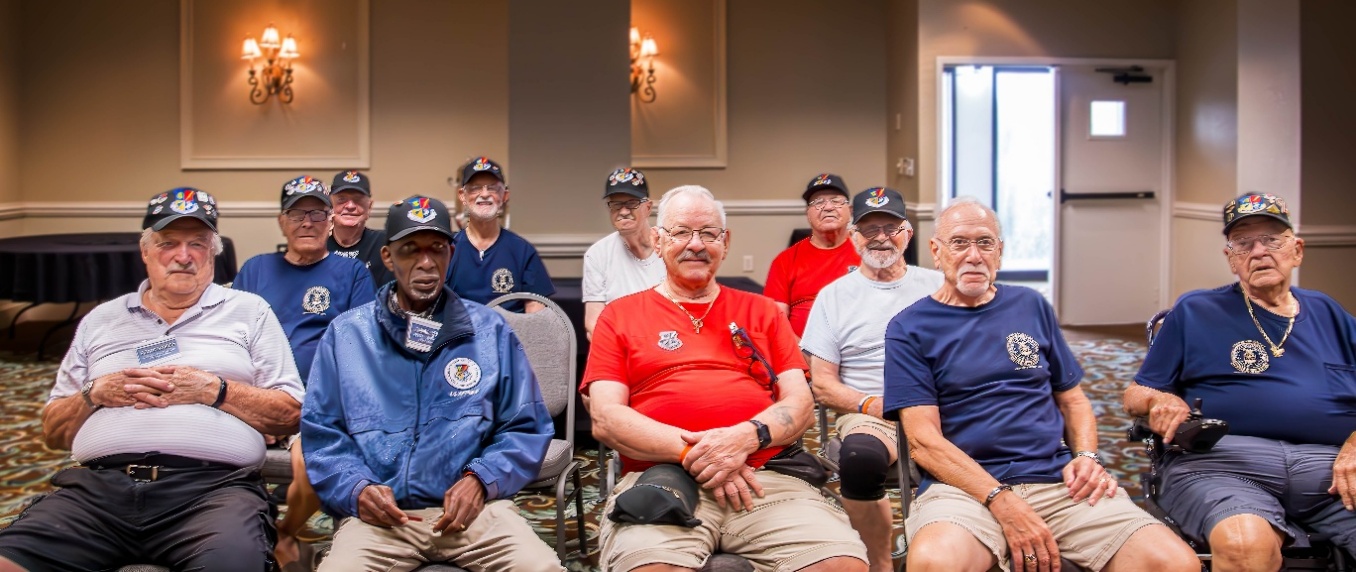 A group of people sitting in chairs

AI-generated content may be incorrect.